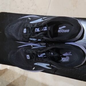 Brooks women's sneakers.  Black and lavender trim. Gently worn. Good condition.